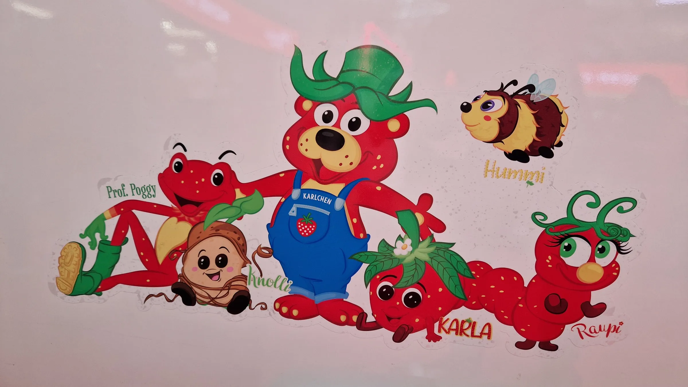 Stickers featuring Karls characters such as Karlchen, Karla, Hummi and Raupi on the side of the photo booth bus
